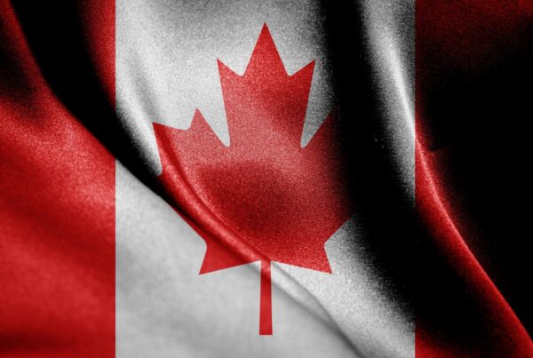 canada flag after immigration to Canada with new program