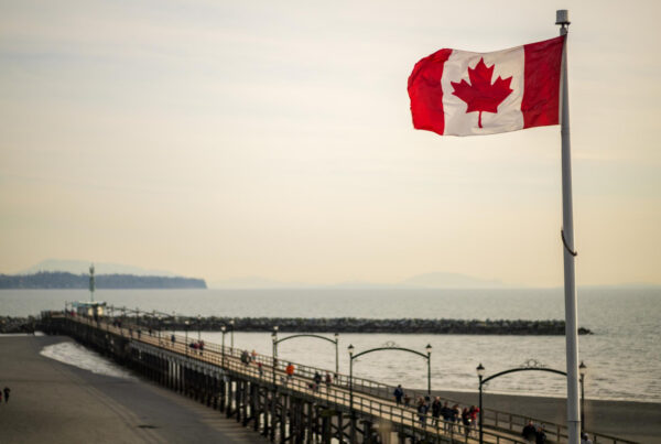 canada flag on beach after permanet immigration