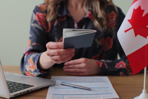 canadian woman consular officer giving passport male immigrant work visa citizenship visa application online form immigration concept visa approval