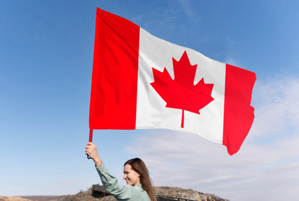 medium shot woman with canadian flag after detention review