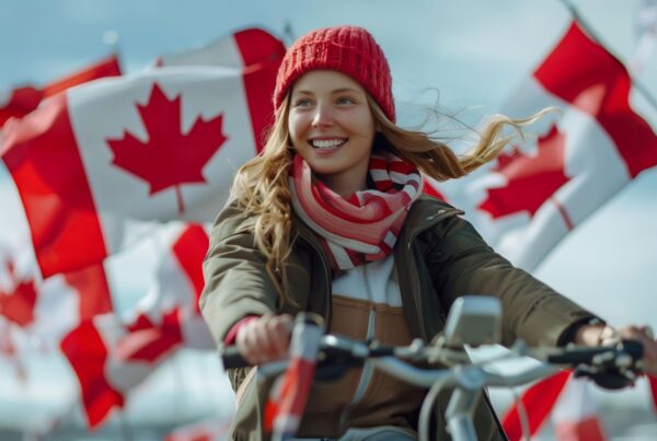 woman holding flag after seeing canadian immigration lawyer