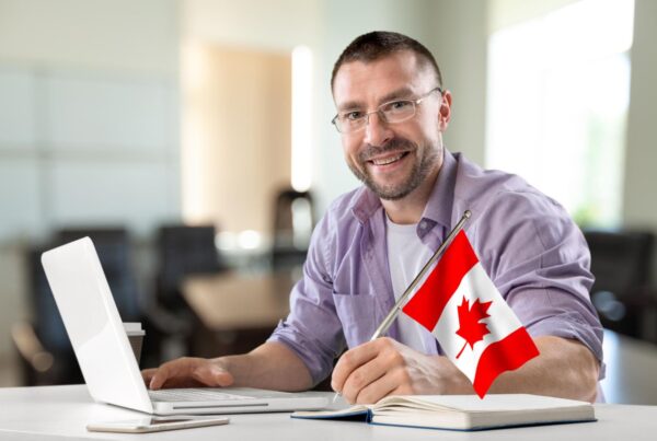 worker working in Canada with new permanent resident status